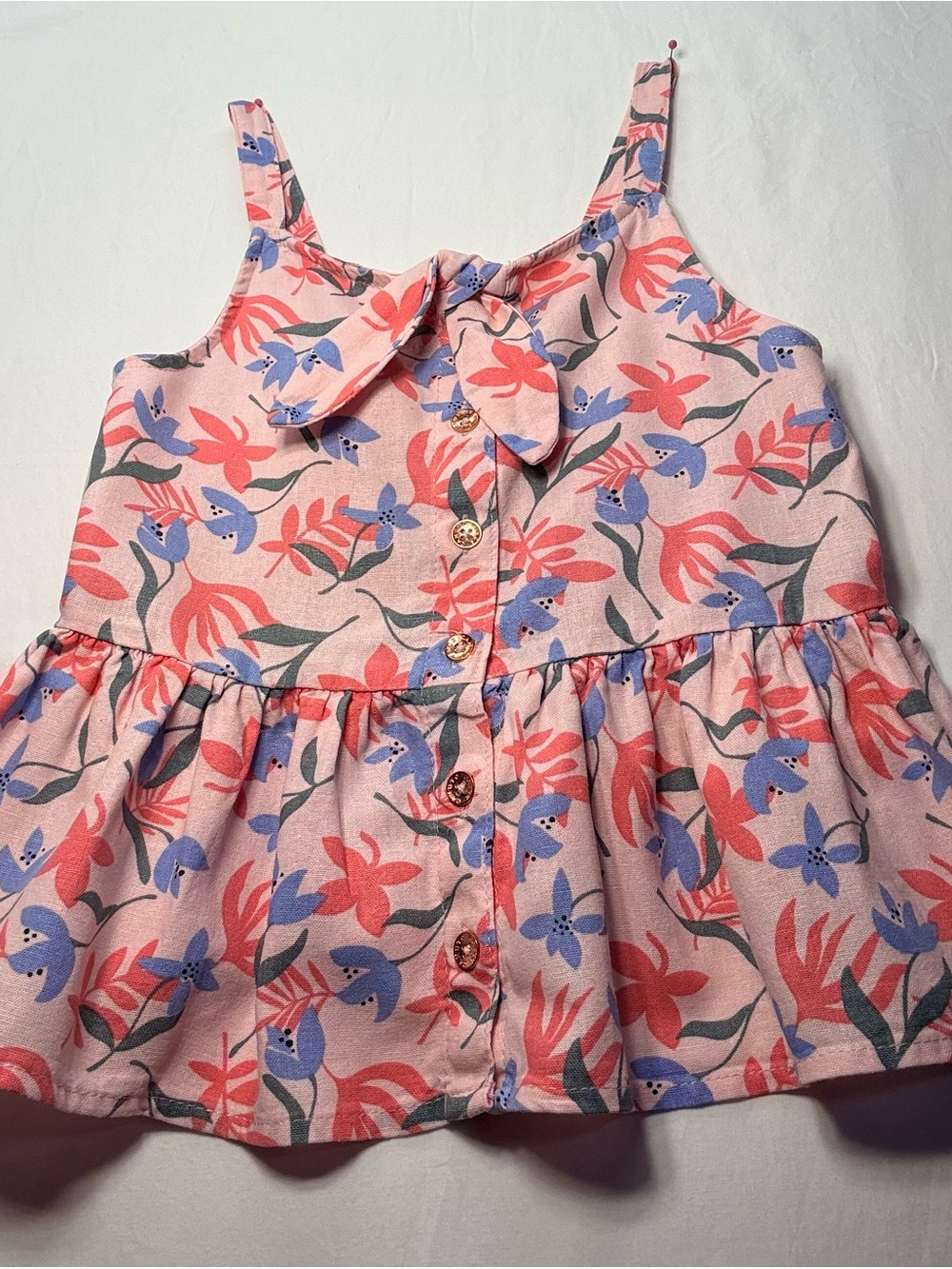 Vince Camuto’s Pink Floral Tie-Front Peplum Top